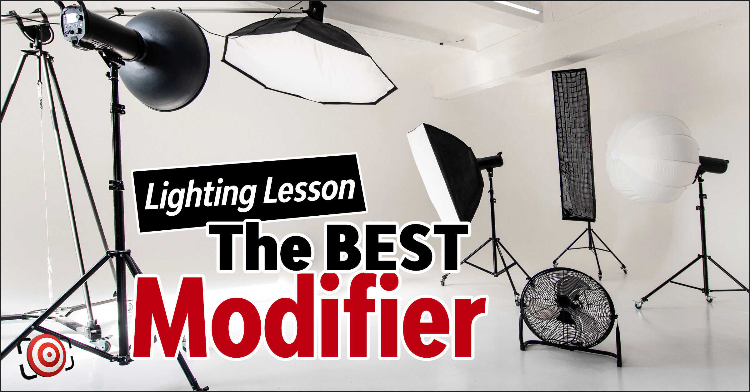 Photography studio with various light modifiers, softboxes, and a fan on a white background, with text overlay reading "Lighting Lesson: The BEST Modifier.